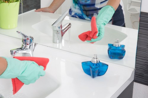 Cleaning team following safe chemical handling procedures